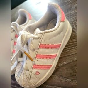 Pink and white adidas